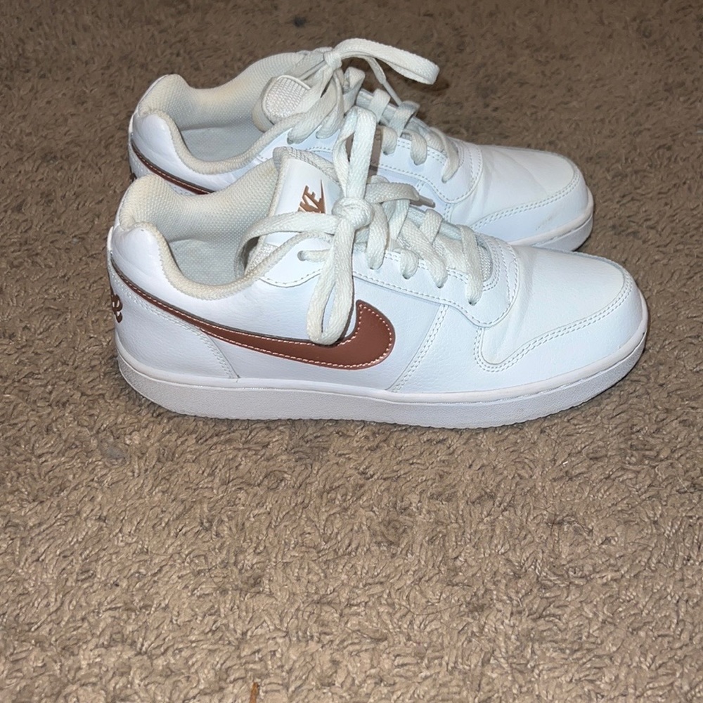 White and rose gold womens Nike sneakers